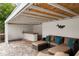 Charming pool cabana with a bar, lounge seating, and stylish details, creating an inviting outdoor relaxation space at 549 39Th Ne Ave, St Petersburg, FL 33703
