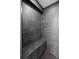 Walk-in shower with gray tile, bench and shelf offers a spa-like experience at 549 39Th Ne Ave, St Petersburg, FL 33703