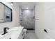 Stylish bathroom boasts sleek vanity, modern fixtures, and a tiled walk-in shower at 7509 E 26Th Ave, Tampa, FL 33619