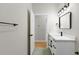 Modern bathroom featuring a sleek vanity, contemporary mirror, and stylish lighting fixtures at 7509 E 26Th Ave, Tampa, FL 33619