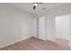 Bedroom features built in wardrobe, wood-look floors, and natural light at 7509 E 26Th Ave, Tampa, FL 33619