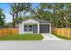 Charming single-story home with a well-manicured lawn and a one car garage at 7509 E 26Th Ave, Tampa, FL 33619