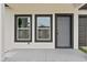 Close up of the front of the house showing the front door and a large window at 7509 E 26Th Ave, Tampa, FL 33619