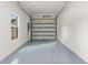 Spacious garage with epoxy floor and natural light; a clean and functional space for parking and storage at 7509 E 26Th Ave, Tampa, FL 33619