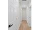 Hallway with paneled white doors and black handles at 7509 E 26Th Ave, Tampa, FL 33619