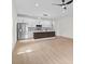Bright kitchen features stainless steel appliances, island with seating, and stylish backsplash at 7509 E 26Th Ave, Tampa, FL 33619