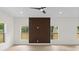 Open floor plan featuring wood-look floors, accent wall and recessed lighting at 7509 E 26Th Ave, Tampa, FL 33619