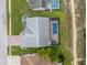 Birds eye view of property, including the back yard with a screened in pool and preserve behind at 8441 Danbury Ln, Hudson, FL 34667