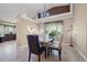 Dining room with modern light fixture and bright natural light at 8441 Danbury Ln, Hudson, FL 34667