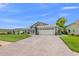 Charming single-Gathering home with a well-manicured lawn and a beautiful red brick driveway at 8441 Danbury Ln, Hudson, FL 34667