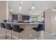 Kitchen island with bar stools and pendant lighting at 8441 Danbury Ln, Hudson, FL 34667