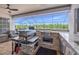 This outdoor kitchen features granite countertops, a stainless grill, and a beautiful view at 8441 Danbury Ln, Hudson, FL 34667