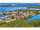 Aerial view indicating a neighborhood location on the lake, with mature trees and lush greenery for premier waterfront living at 944 San Carlos Ne Ct, St Petersburg, FL 33702