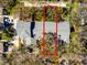 Aerial view of a property with a defined tree coverage area, showing its position on the property at 944 San Carlos Ne Ct, St Petersburg, FL 33702