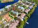 A waterfront community with serene landscaping and houses nestled closely to the water and a private dock at 944 San Carlos Ne Ct, St Petersburg, FL 33702