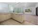 Bathroom featuring a large mirror, updated vanity, and view into bedroom at 944 San Carlos Ne Ct, St Petersburg, FL 33702