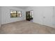 Cozy bedroom with plush carpeting, a large window, and a sliding glass door at 944 San Carlos Ne Ct, St Petersburg, FL 33702