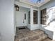 Inviting covered front entrance with tiled steps and a well-lit entryway at 944 San Carlos Ne Ct, St Petersburg, FL 33702