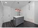 Stylish kitchen featuring an island, grey cabinets and red pendant lighting at 944 San Carlos Ne Ct, St Petersburg, FL 33702