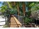 Scenic walkway through lush greenery, providing a serene atmosphere at 944 San Carlos Ne Ct, St Petersburg, FL 33702