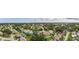 Panoramic aerial view of the neighborhood with mature trees and well-maintained homes at 1051 Glynwood Pl, Dunedin, FL 34698