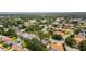 Wide aerial view of neighborhood and mature trees at 1051 Glynwood Pl, Dunedin, FL 34698