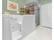 Bathroom features a walk-in tub with jets and a glass enclosed shower at 1051 Glynwood Pl, Dunedin, FL 34698