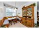 Charming breakfast nook with built-in seating and antique hutch at 1051 Glynwood Pl, Dunedin, FL 34698