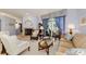 Cozy living room with a fireplace, comfortable seating, and sliding glass doors leading to outdoor space at 1051 Glynwood Pl, Dunedin, FL 34698