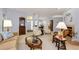 Spacious open-plan living room with views of the dining area and fireplace at 1051 Glynwood Pl, Dunedin, FL 34698