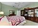 The main bedroom features an entertainment system and a walk-in closet at 1051 Glynwood Pl, Dunedin, FL 34698
