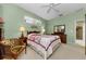 The main bedroom has soft colored walls, carpeted floors, and natural light at 1051 Glynwood Pl, Dunedin, FL 34698