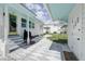 Charming backyard showcasing a patio, manicured lawn, and lush landscaping at 106 W Minnehaha St, Tampa, FL 33604