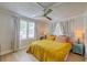 Sunlit bedroom with large windows, ceiling fan and natural light at 106 W Minnehaha St, Tampa, FL 33604