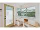 An exterior door, a table and bench seating, and windows at 106 W Minnehaha St, Tampa, FL 33604
