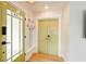 Welcoming entryway featuring a stylish door and practical storage solutions at 106 W Minnehaha St, Tampa, FL 33604