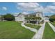 Charming home featuring a well-manicured lawn, walkway, and detached garage at 106 W Minnehaha St, Tampa, FL 33604