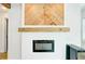 Close-up of the decorative fireplace with wood mantel and electric insert at 106 W Minnehaha St, Tampa, FL 33604