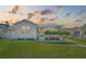 Charming single-story home featuring a well-manicured lawn and a welcoming front porch with meticulously kept shrubs at 106 W Minnehaha St, Tampa, FL 33604