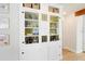 A built-in cabinet with display shelving, with baskets on top at 106 W Minnehaha St, Tampa, FL 33604