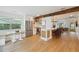 Bright kitchen with stainless steel appliances, breakfast bar, and decorative wood beam at 106 W Minnehaha St, Tampa, FL 33604