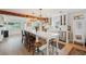 A kitchen featuring a large island with seating, farmhouse sink, pendant lighting, and stainless steel appliances at 106 W Minnehaha St, Tampa, FL 33604