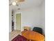 Well-lit interior with a wooden desk and chair and a colorful rug at 106 W Minnehaha St, Tampa, FL 33604