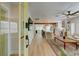 Open-concept living space showcasing hardwood floors and ample natural light at 106 W Minnehaha St, Tampa, FL 33604