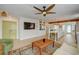 Spacious living room featuring hardwood floors and an open layout to the kitchen at 106 W Minnehaha St, Tampa, FL 33604