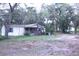 Exterior of a home with mature trees and a partially covered front porch at 10641 Atlee St, New Port Richey, FL 34654