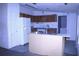 Kitchen area featuring cabinetry, a refrigerator, and a center island at 10641 Atlee St, New Port Richey, FL 34654