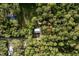 Aerial view showcasing a home nestled among lush greenery at 10804 Bounty St, New Port Richey, FL 34654