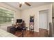 Bedroom with a desk, gaming chair, and closet for ample storage at 10804 Bounty St, New Port Richey, FL 34654