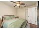 Comfortable bedroom with a ceiling fan, wood furniture, and a closet at 10804 Bounty St, New Port Richey, FL 34654